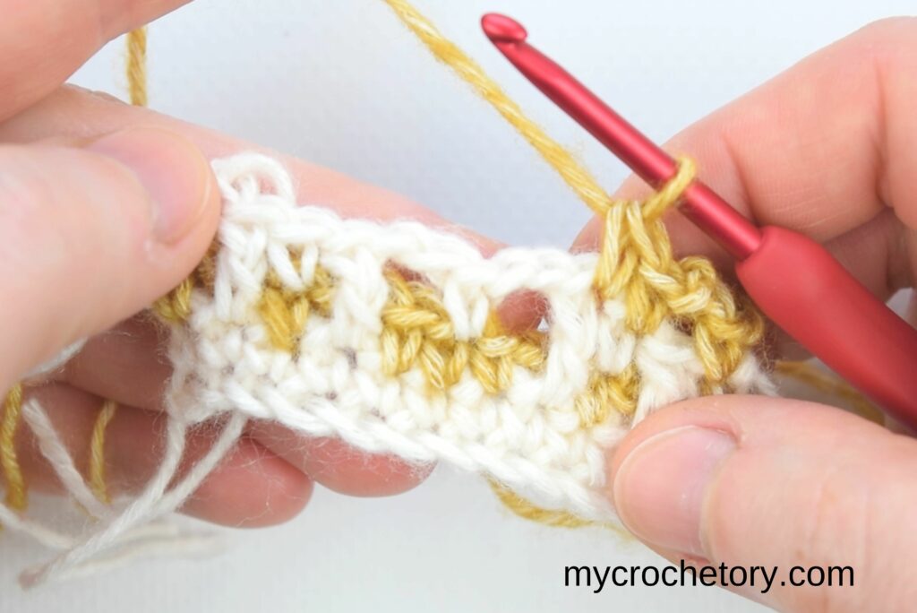Mosaic Crochet Tutorial: hands holding the mosaic crochet swatch