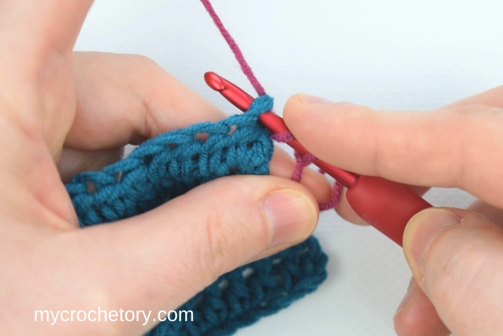 How To Crochet Standing Stitches: half double crochet - inserting the hook in the first stitch