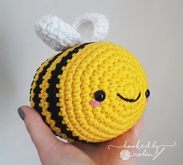 Cute crochet bee made with yellow, black, and white yarn. This crochet animal pattern free is perfect for beginners.