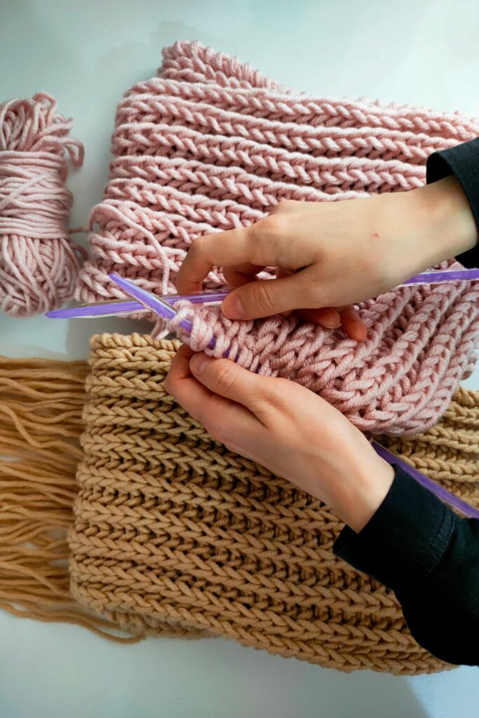 Hands crafting with yarn for crochet vs knitting yarn technique