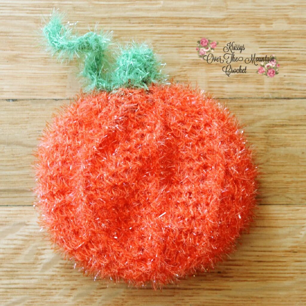 Pumpkin Pot Scrubber - cute pumpkin-shaped scrubber for fall, perfect for scrubby yarn crochet patterns.