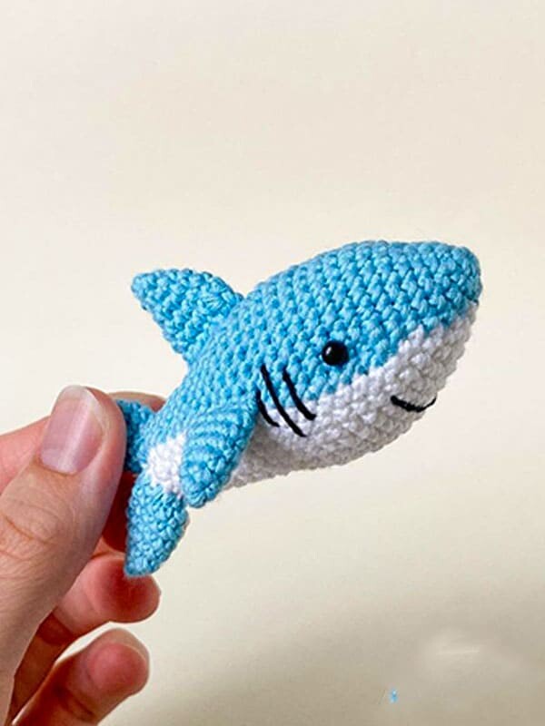 Fun crochet baby shark. This crochet animal pattern free is great for keychains.