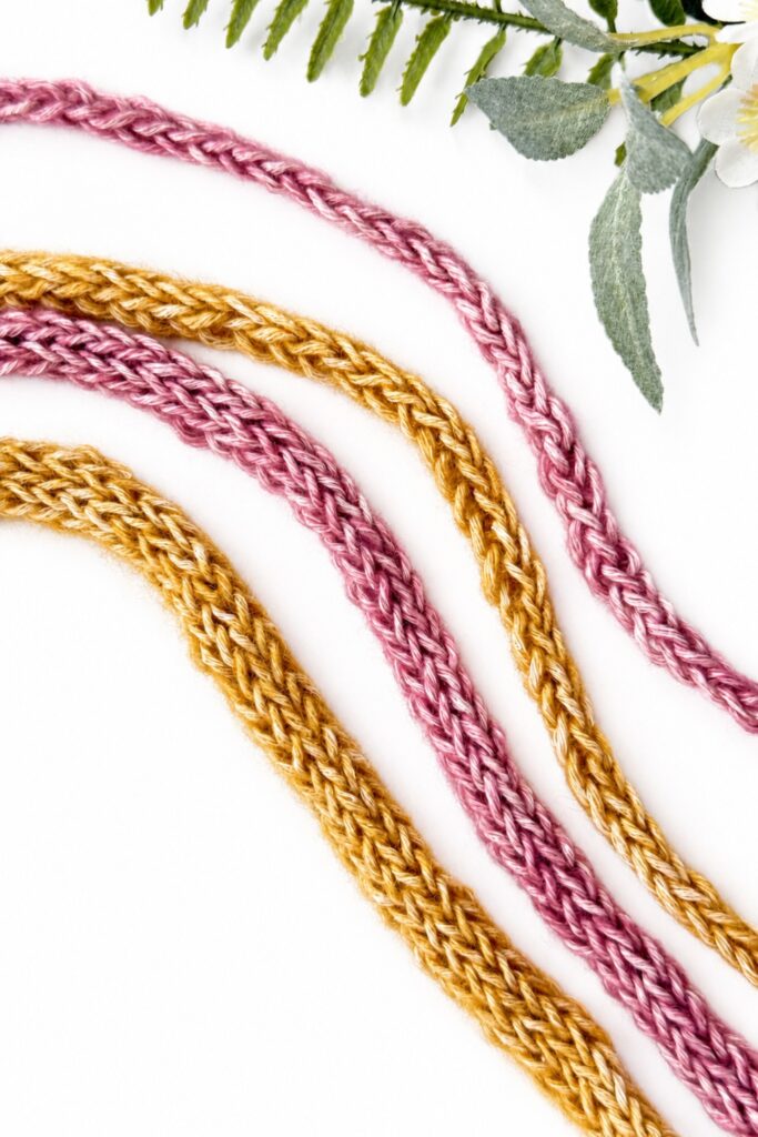 Pink and mustard crochet I-Cords showing a sturdy rounded cord texture