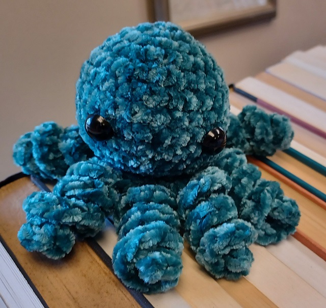Easy crochet mini octopus with one-piece tentacles. This crochet animal pattern free is fun and customizable.