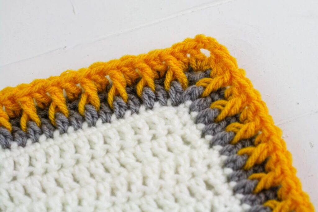 Crochet borders easy: rich textured Alpine Stitch Blanket Border.