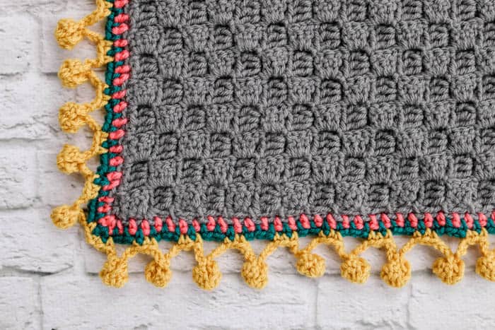 Crochet borders easy: playful Bobble Stitch Border with vibrant edges.