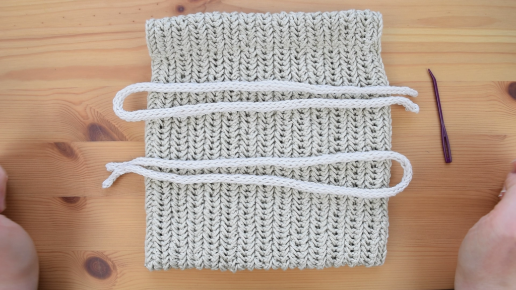 Two I-cord drawstrings prepared for the crochet drawstring bag pattern