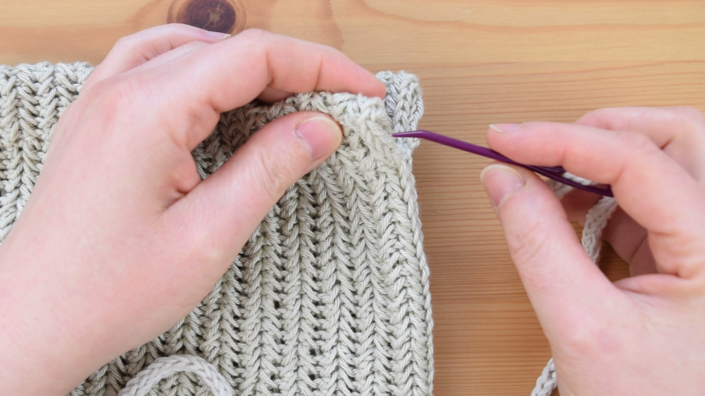 Inserting needle into crochet drawstring bag pattern