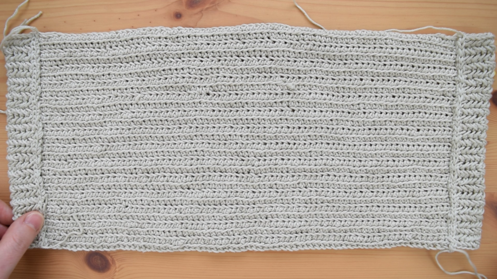 Flat layout of the crochet drawstring bag pattern before assembly