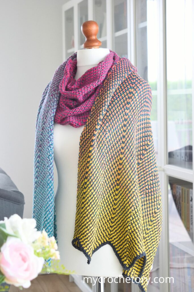 Stunning free pattern crochet scarf in a chevron design, featuring the Flourish Linen Wrap.