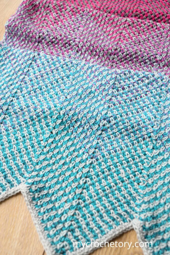 Detailed stitch view of the Flourish Linen Wrap, a free pattern crochet scarf in contrasting tones.
