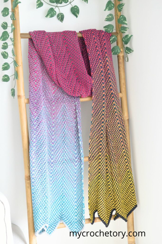 Chevron style free pattern crochet scarf in multicolored yarns, the Flourish Linen Wrap on display.