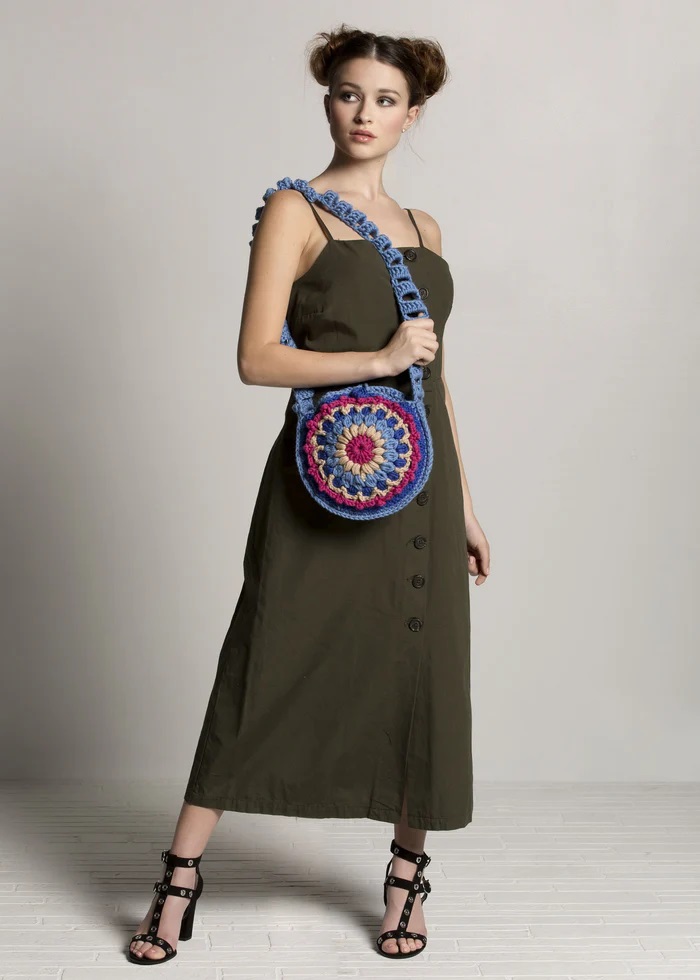 Vibrant mandala design in the starburst satchel – intricate crochet bags patterns.