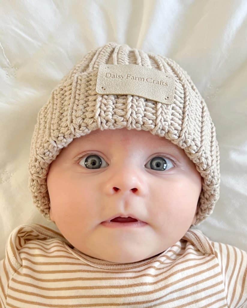 Adorable baby wearing a cozy crochet hat, perfect for infant crochet hat patterns.