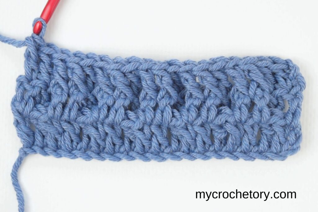 Finished third row of the waffle stitch crochet pattern.