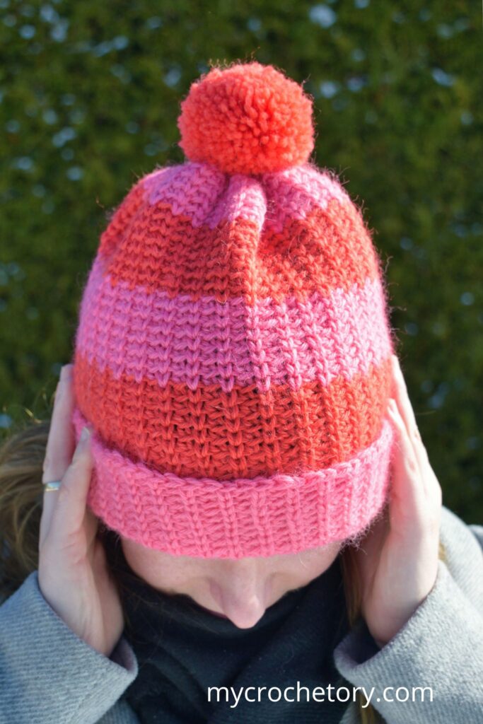 Close-up of the knit-look texture in this fast crochet hat pattern, made with clever stitches.