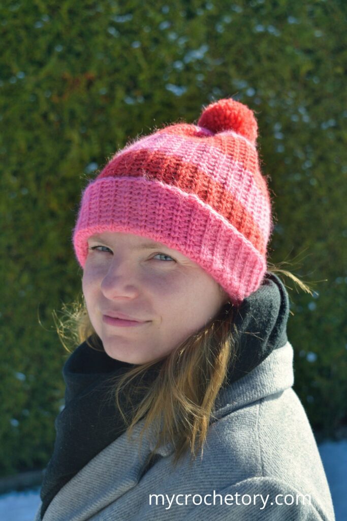 Side view of the Fleur de Stripe Hat, a fast crochet hat pattern with a folded brim.