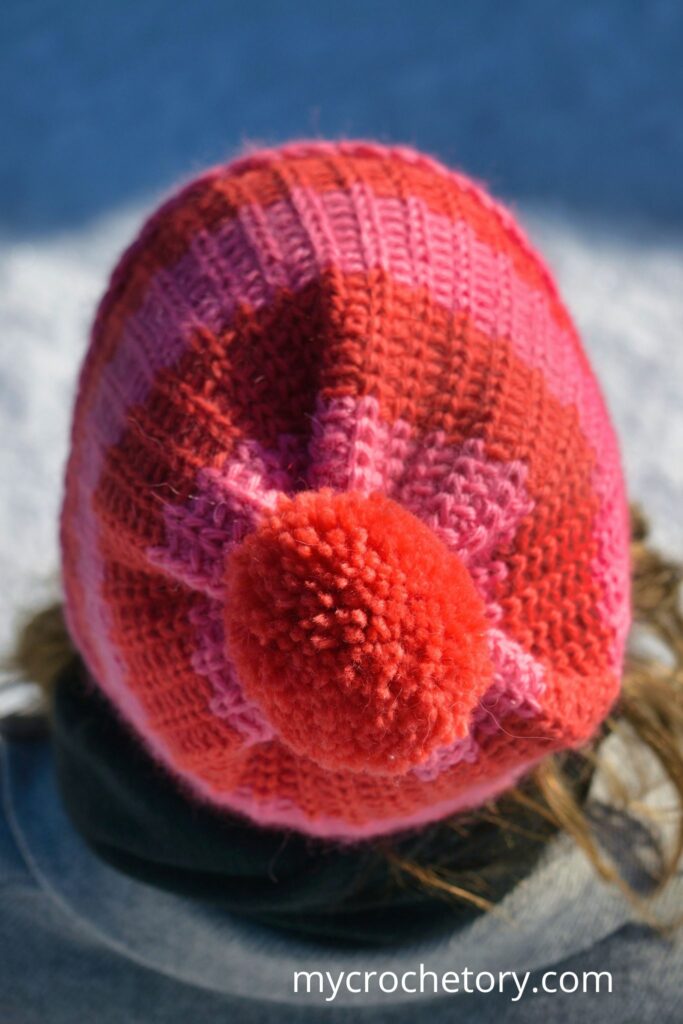 A close-up of the fast crochet hat pattern showcasing the neat knit-look stitchwork.