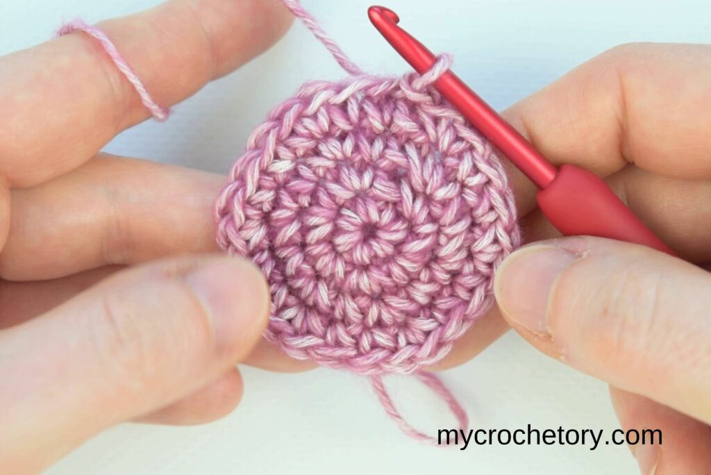In-progress demonstration of how to crochet a circle with smooth, even stitches.