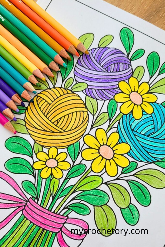 Finished yarn bouquet page from a crochet coloring book, shaded with vibrant colored pencils.