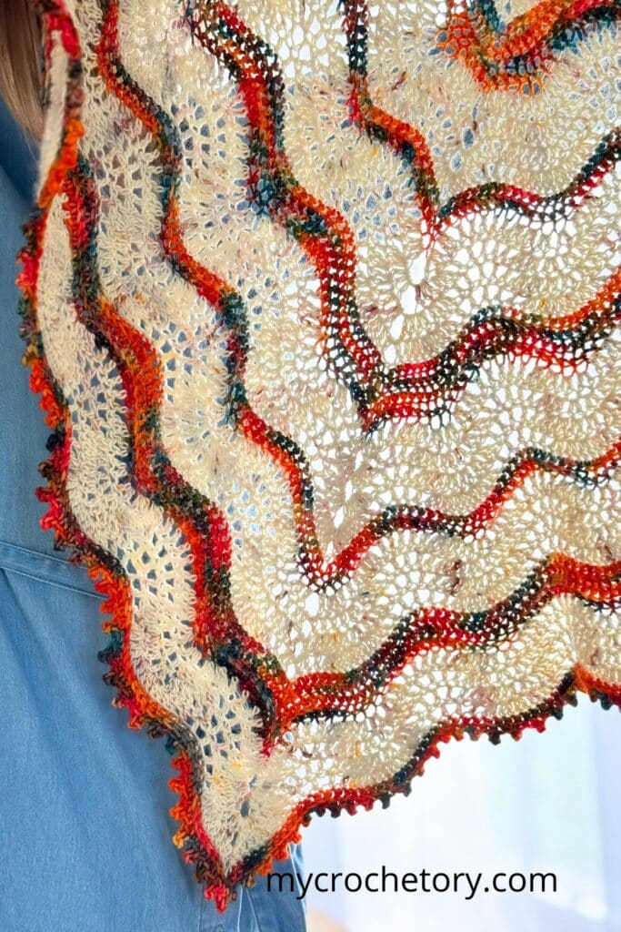 Detail shot of the Norra boho shawl crochet pattern highlighting the picot edging and color contrast.