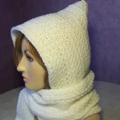 White crochet hooded scarf displayed on mannequin, showing simple beginner-friendly textured stitches.
