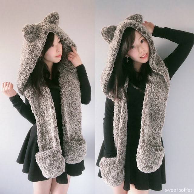 Woman wearing a fuzzy crochet hooded scarf with bear ears and pockets, made with faux fur yarn.