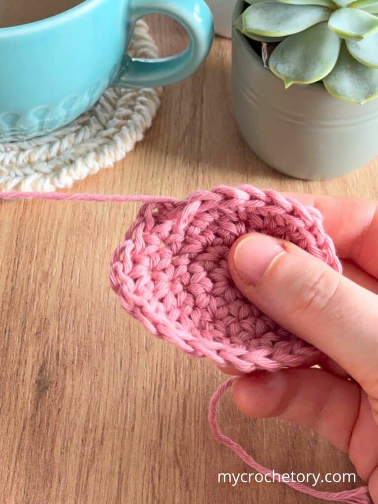 Undoing a crochet circle (frogging) to fix curling caused by incorrect stitch count or tight tension