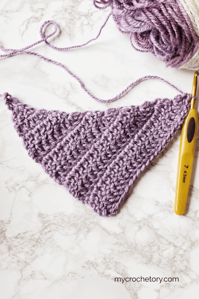 Asymmetrical crochet shawl shaping created by increasing on one side only