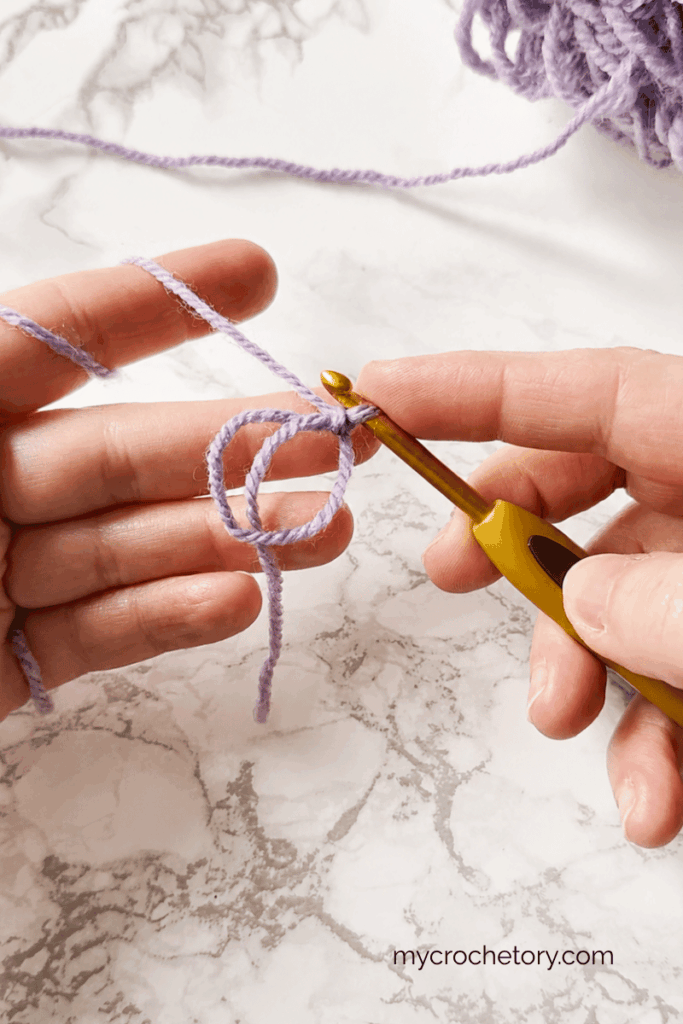 Starting a top down triangle crochet shawl with a magic ring and double crochet stitches