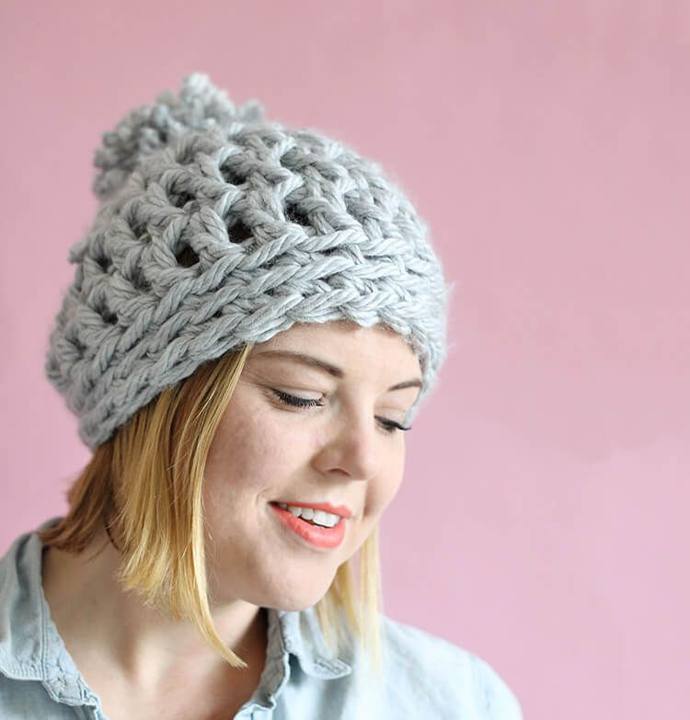 Woman wearing a gray super chunky crochet beanie
