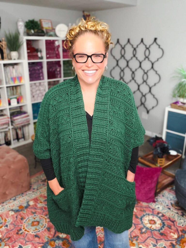 Creekside crochet ruana in pine green with big front pockets