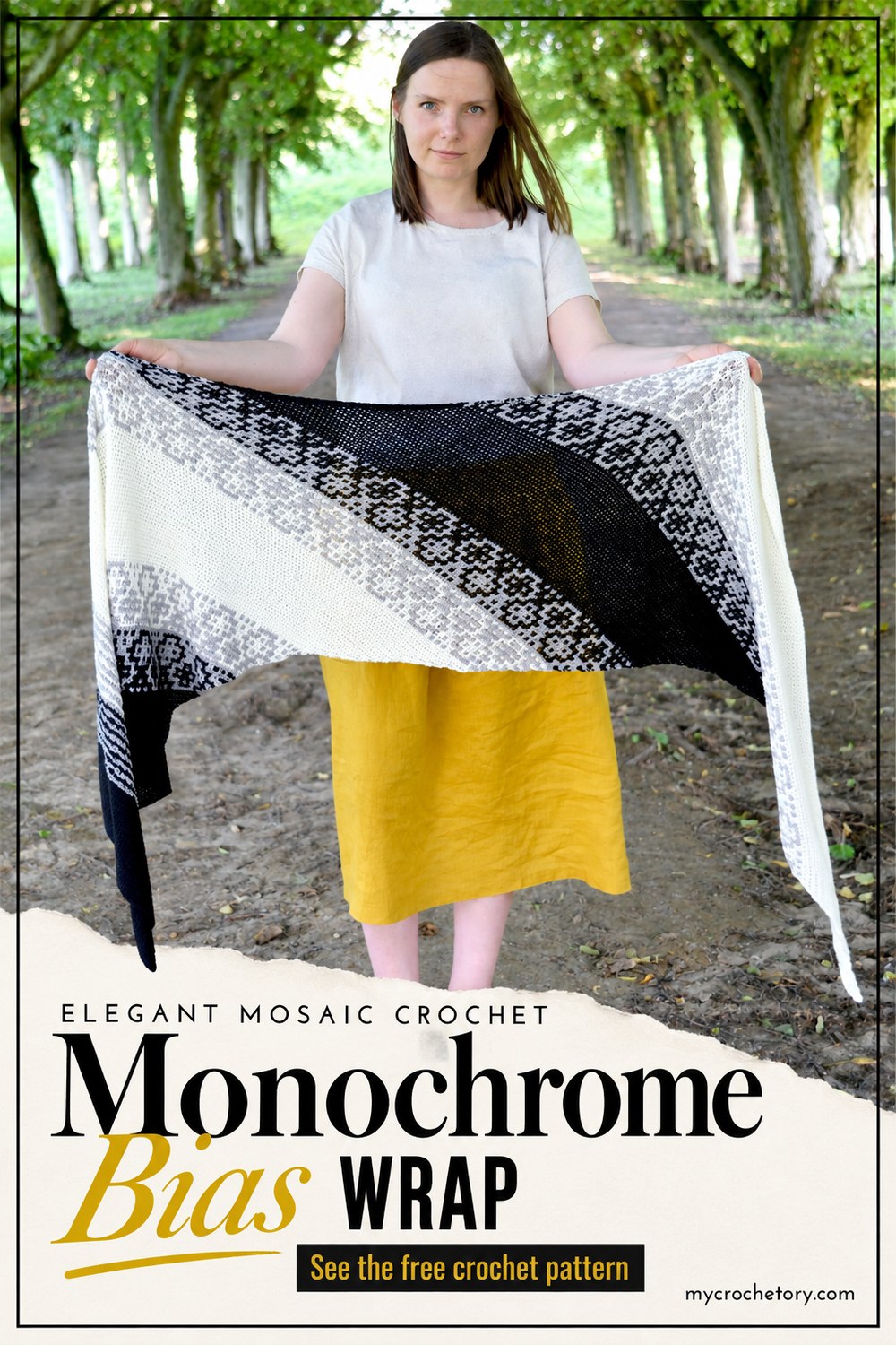 Elegant mosaic crochet Monochrome Bias Wrap pin, woman holding a black and white rectangle shawl