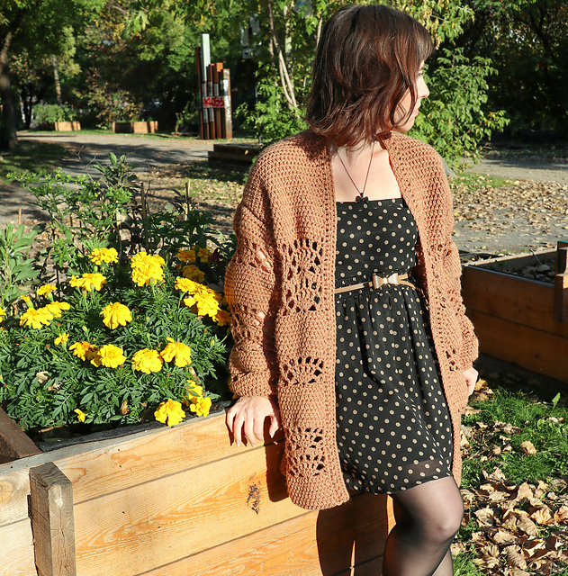 	Fall For Me crochet cardigan in caramel brown with lace panels, worn over a polka dot dress