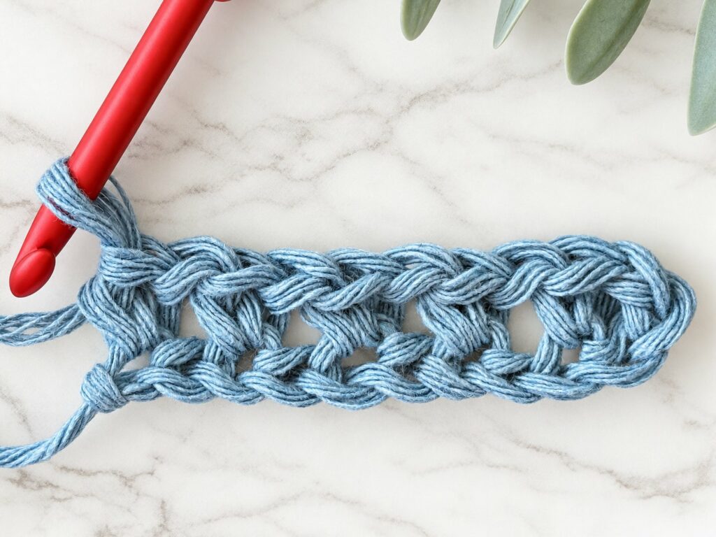 Moss stitch row 1 with small gaps between the stitches