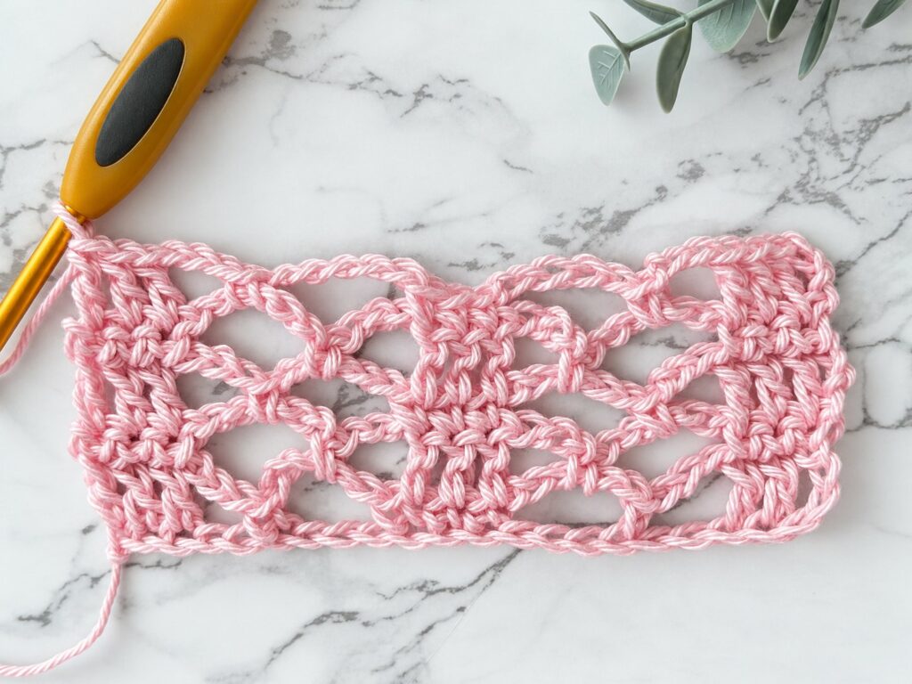Sunny Lace Cowl swatch in progress, several rows of lace