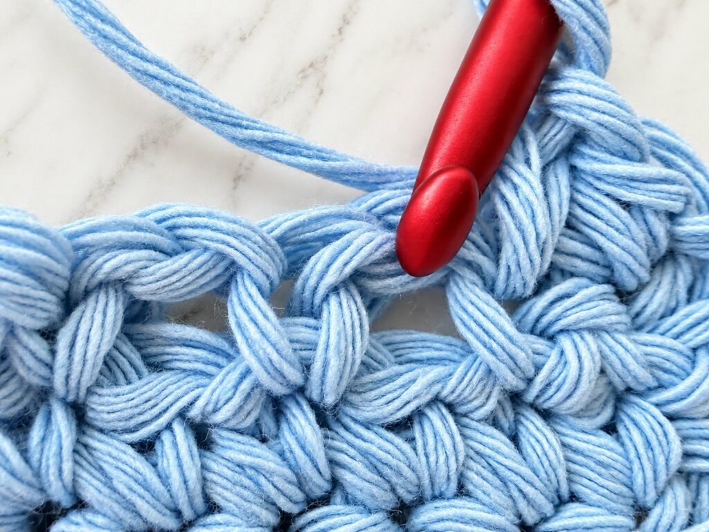 Crochet hook going into a chain space