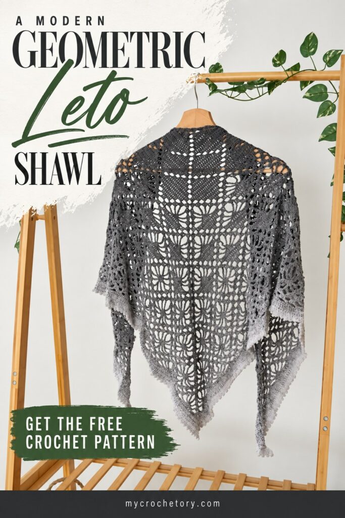 A modern geometric Leto Shawl pin, gray gradient crochet shawl on a wooden hanger